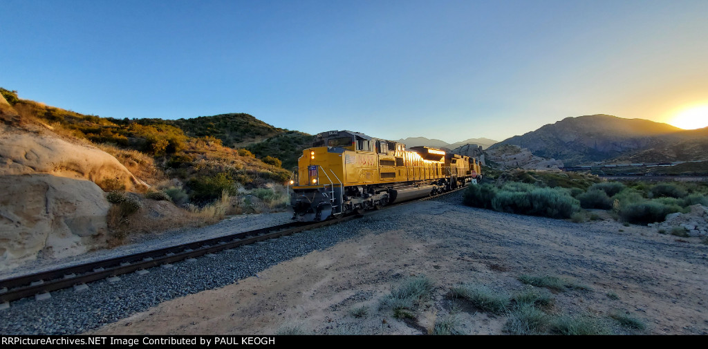 UP 8632 and UP 6963 Decend towards the UP West Colton Yard, Ca at Sunset on The Palmdale Cutoff at The South Canyon Siding in Cajon Pass.